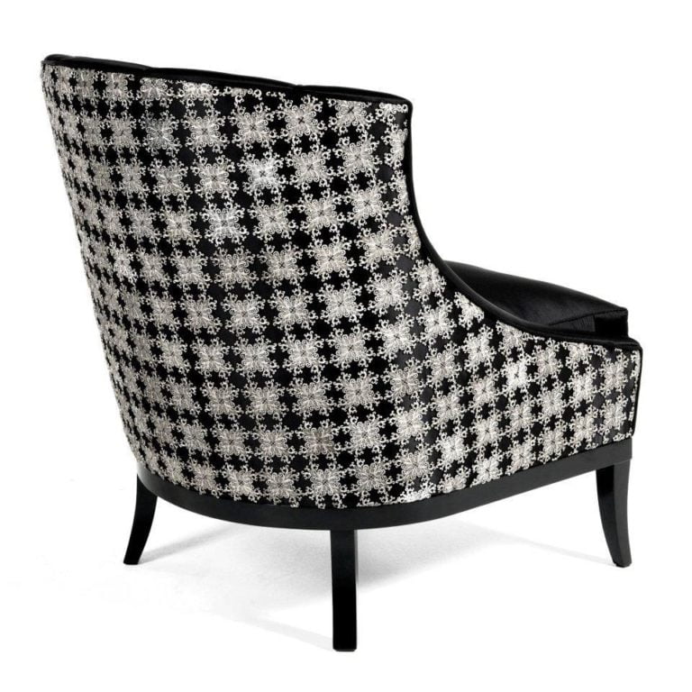 Stylish black and silver accent chair featuring a unique floral pattern, perfect for modern interior design and home decor.