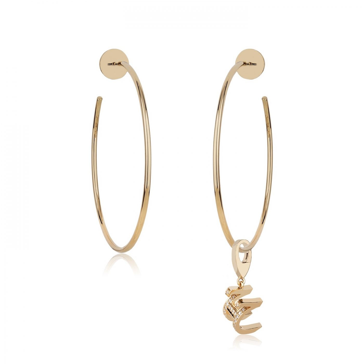 Gold hoop earrings featuring a charm, designed for elegance and style, perfect for accessorizing various outfits.