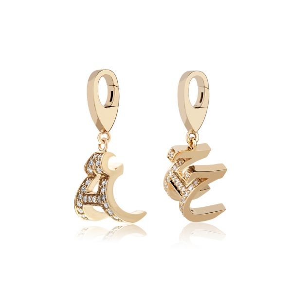 Elegant gold Arabic charms adorned with sparkling diamonds, showcasing intricate designs and craftsmanship.