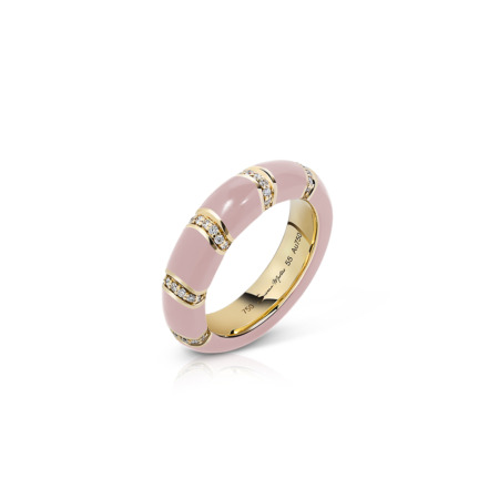 A pink band ring featuring gold accents and decorative elements, displayed on a white background.