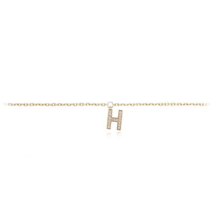 Gold anklet featuring a diamond-encrusted letter H charm, perfect for elegant accessorizing. Stylish jewelry piece for various occasions.