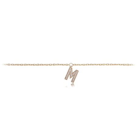 Gold anklet featuring a diamond-encrusted letter M charm on a delicate chain, showcasing elegance and personalization.