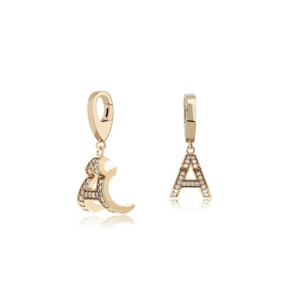 Gold earrings featuring Arabic letter and A initial adorned with sparkling crystals, showcasing elegant jewelry design.
