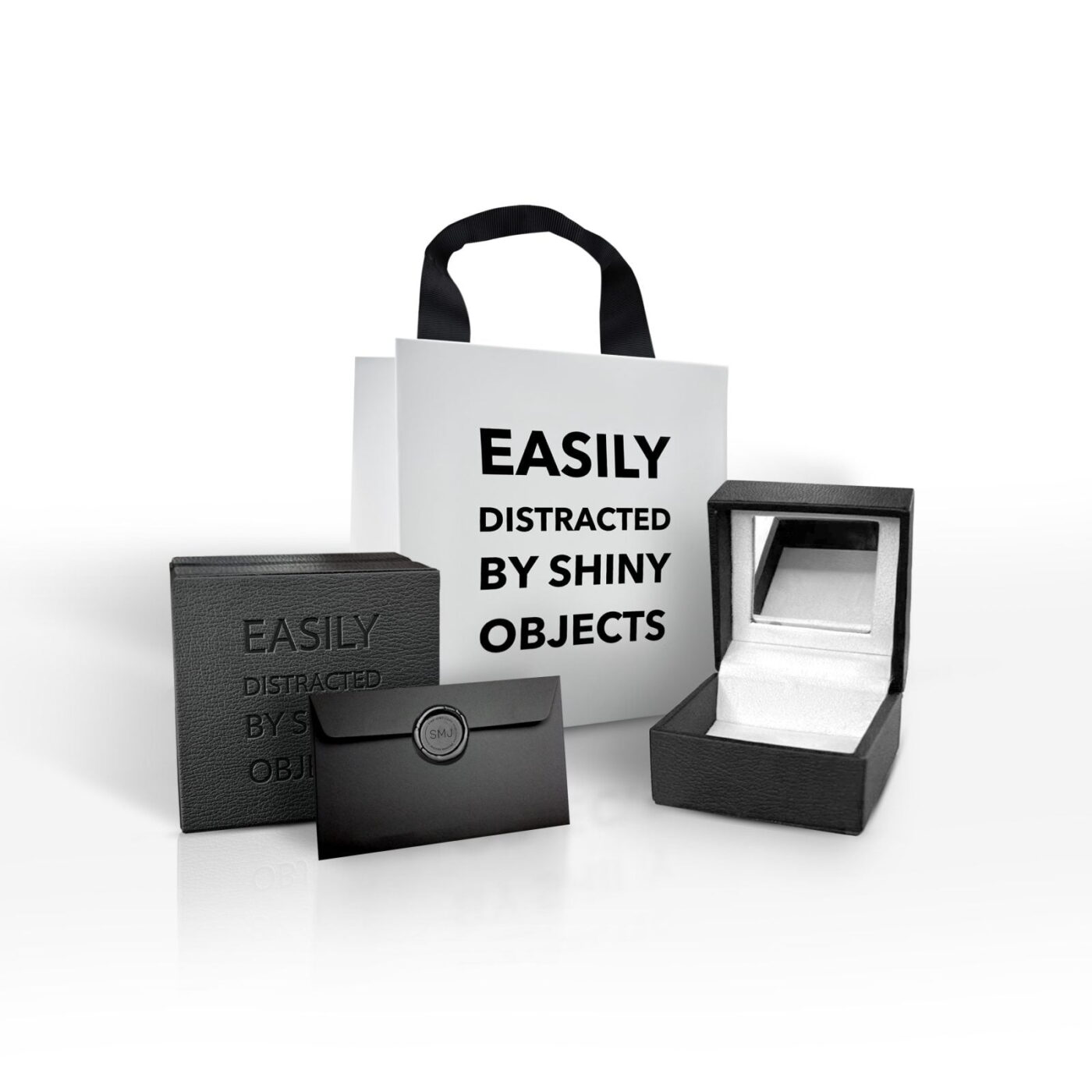 Easily distracted by shiny objects packaging set featuring a gift bag, box, and jewelry case, ideal for unique gifting experiences.