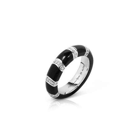 A black band ring featuring white sections and small diamonds set in the design.