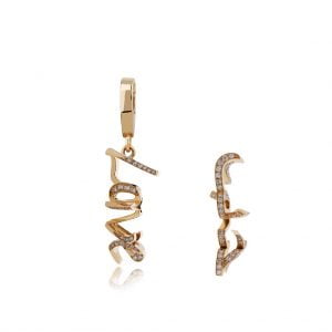 3D double love gold earrings with sparkling stones, showcasing a unique design. Perfect accessory for stylish outfits.