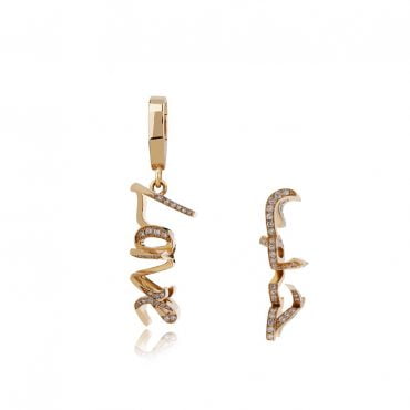 3D double love gold earrings with sparkling stones, showcasing a unique design. Perfect accessory for stylish outfits.