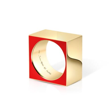 A striking gold ring featuring a bold red square design, showcasing modern geometric style and elegance for contemporary jewelry collections.