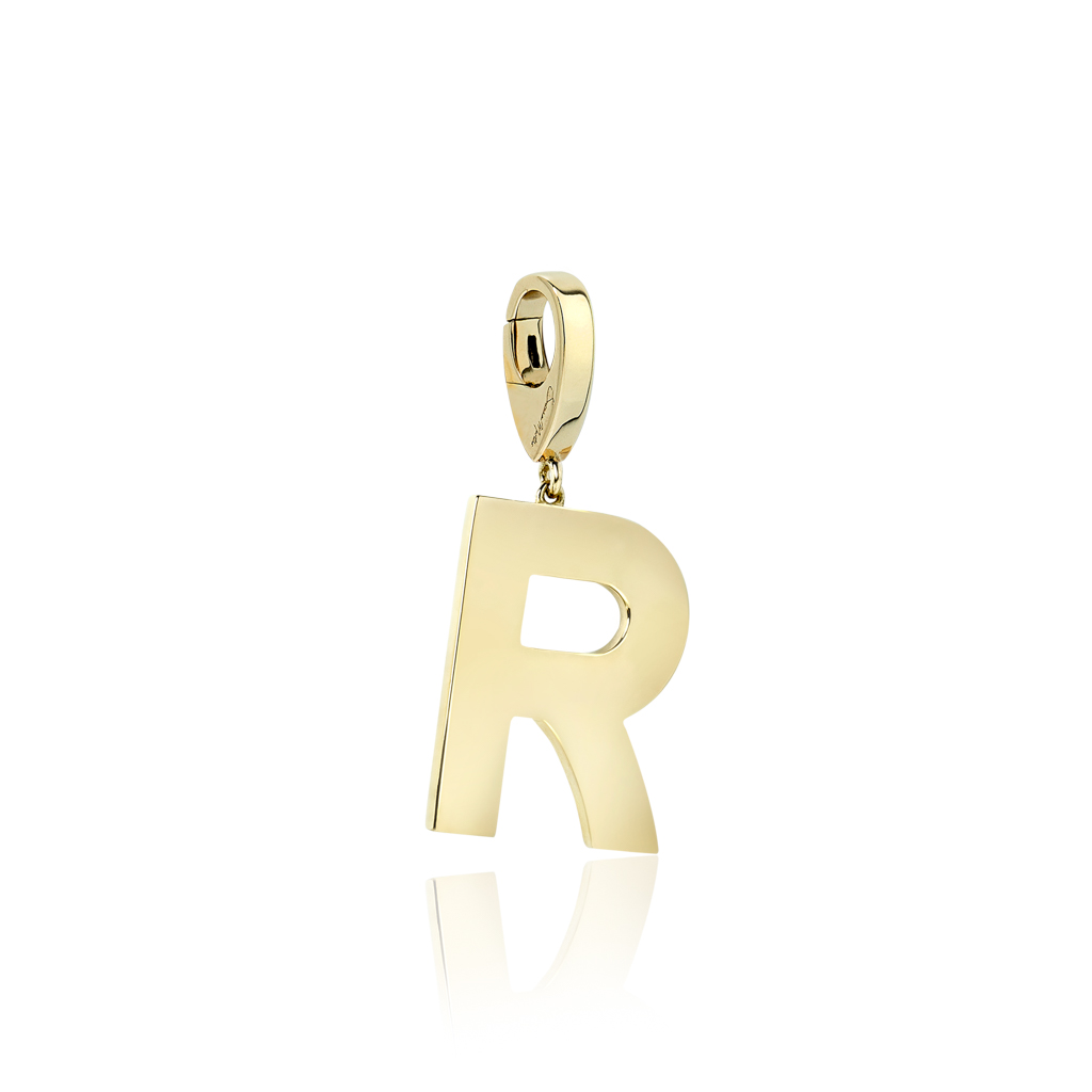 Gold charm in the shape of the letter R with a polished finish and a loop for attachment.