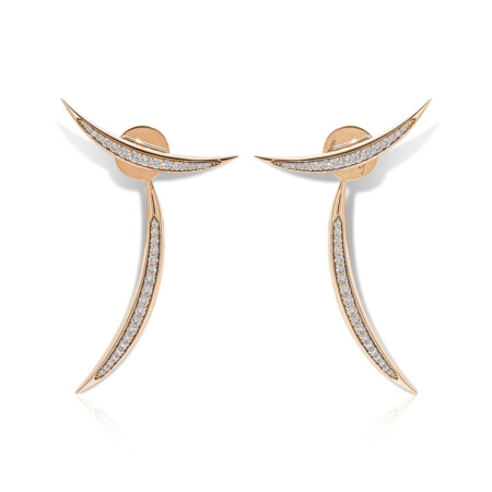 Elegant Calatrava diamond strokes earrings in rose gold, featuring a unique curved design adorned with sparkling diamonds.
