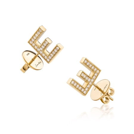 Gold letter E stud earrings adorned with diamonds, showcasing a modern design and elegant craftsmanship.