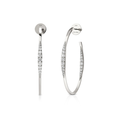 Silver hoop earrings featuring a sleek design with embedded diamonds along one side.
