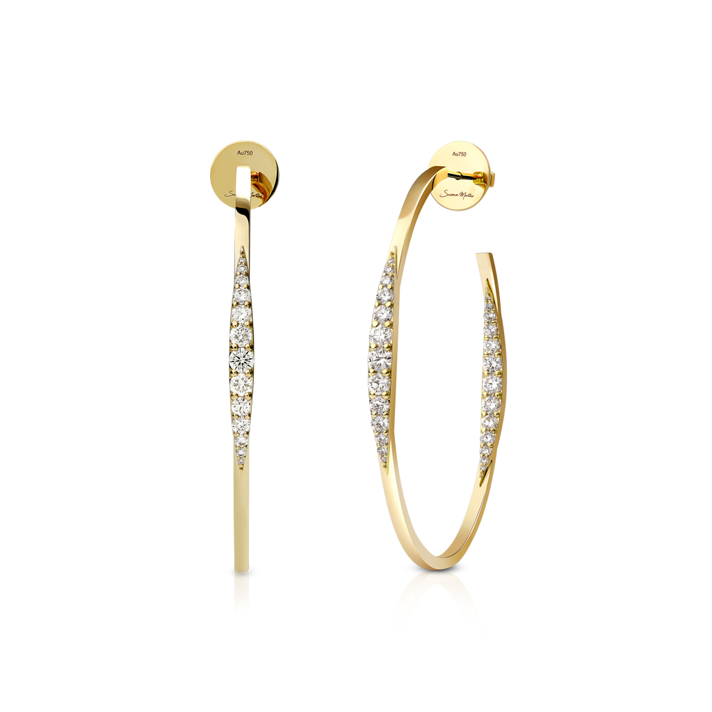 Gold hoop earrings featuring a curved design with diamond accents along one side.