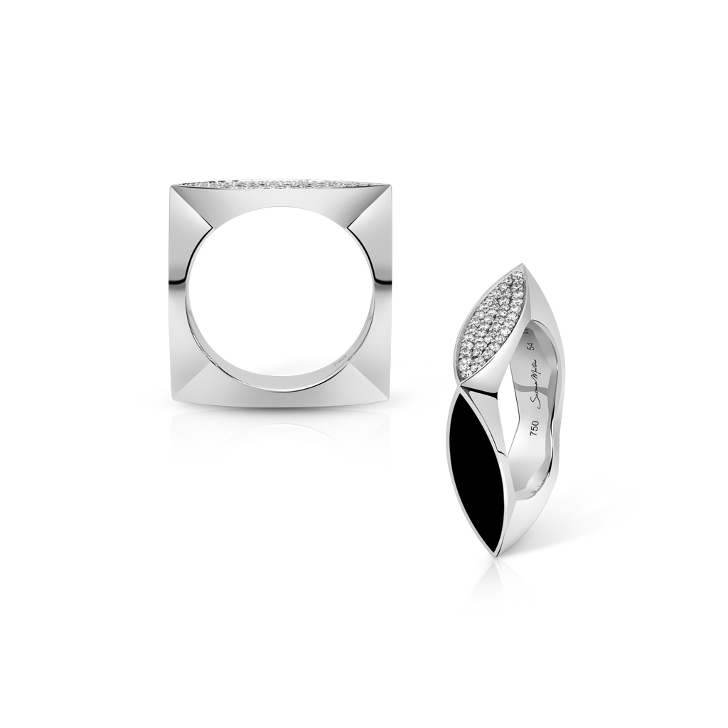 Two silver rings featuring geometric shapes, one square and one oval with black and white accents.