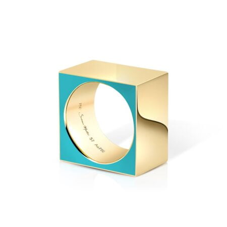 Turquoise and gold geometric ring featuring a square design with a circular cutout, showcasing modern jewelry craftsmanship.