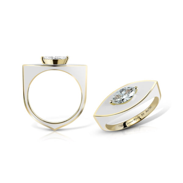 Elegant gold ring set featuring a large diamond and a unique shield design, showcasing modern jewelry craftsmanship.