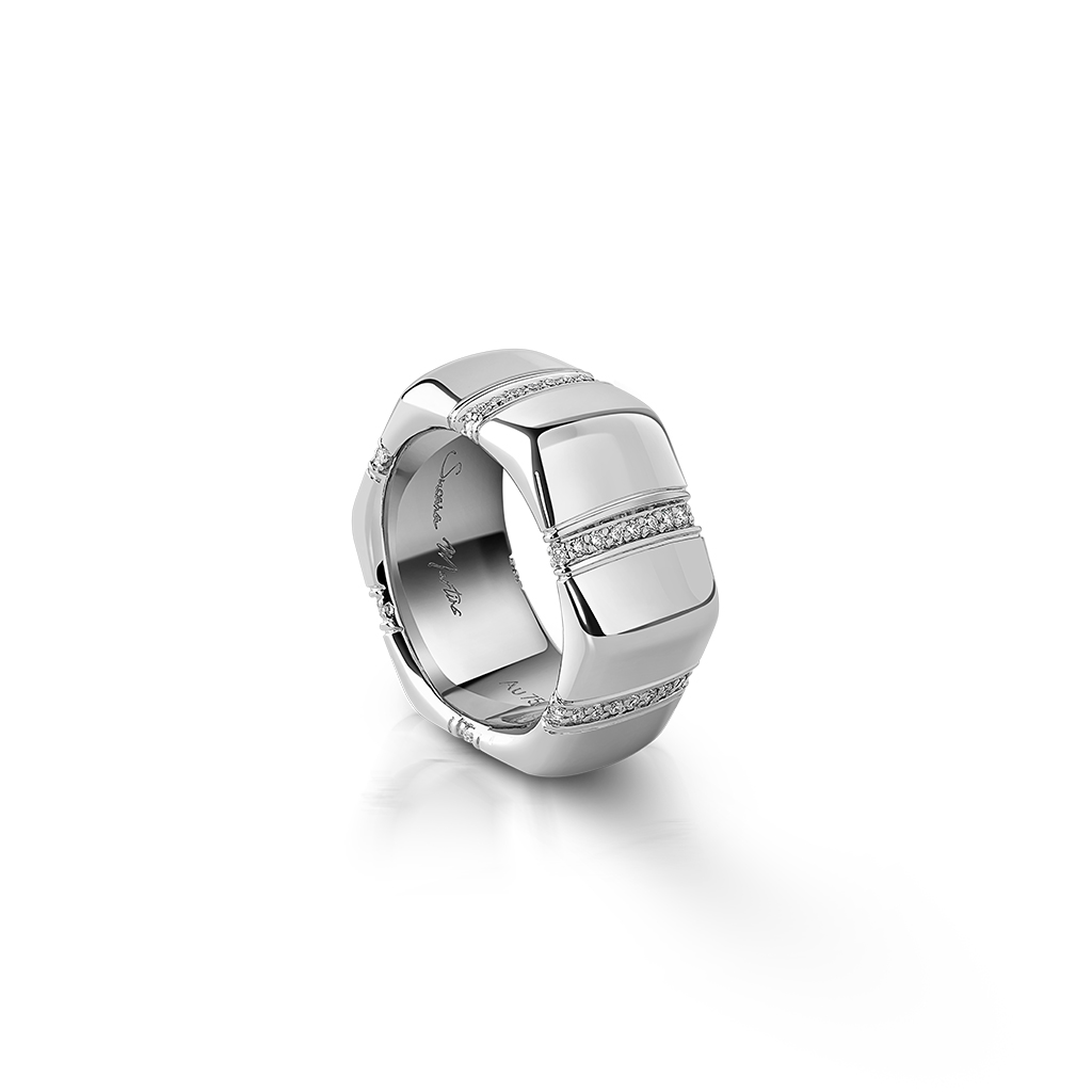 Silver ring featuring a geometric design with diamond accents along the band.