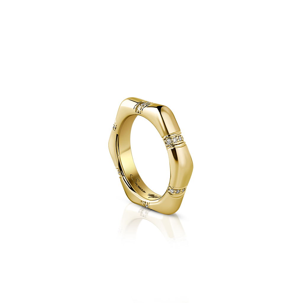 Gold octagonal ring featuring small diamond accents on the surface.