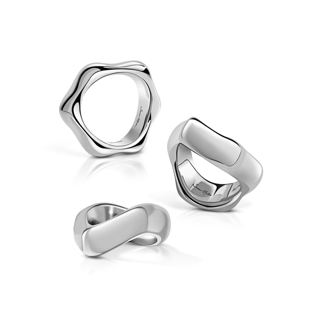 Three silver rings featuring distinct shapes and polished finishes arranged together.
