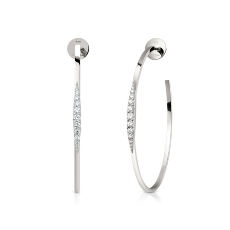 Silver hoop earrings featuring diamond accents along one side in a sleek design.