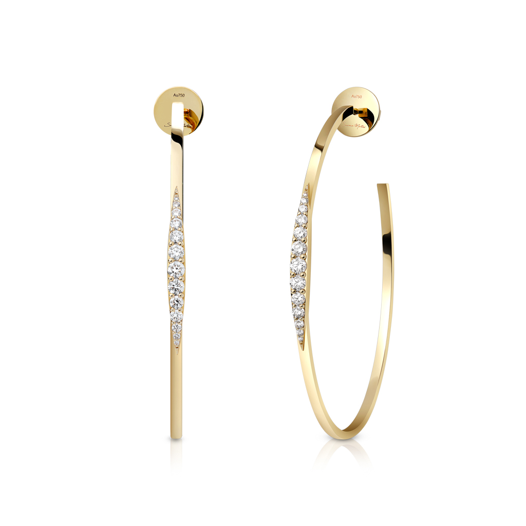 Gold hoop earrings featuring a sleek design with diamond accents along one side.