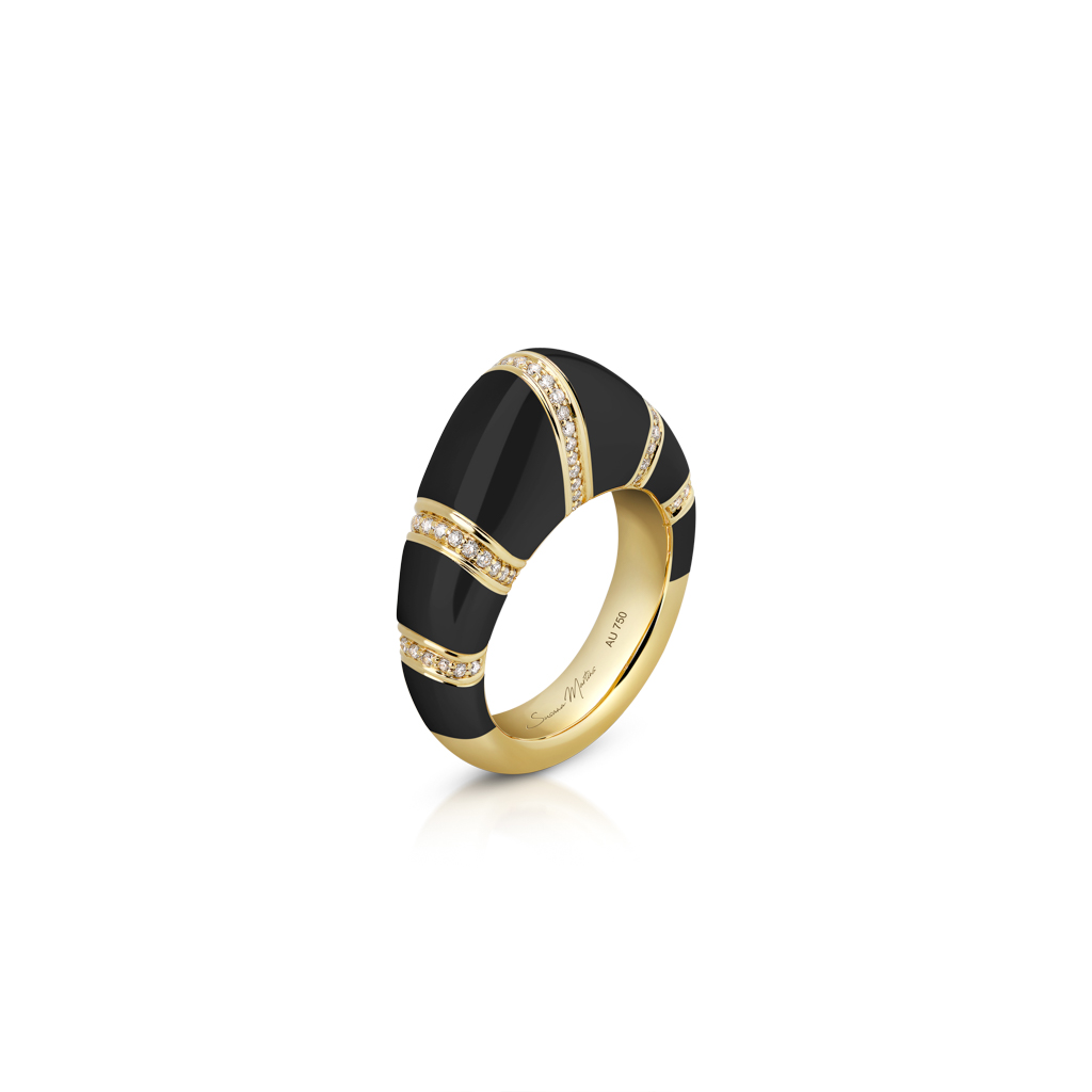 Gold dome ring featuring black enamel and decorative diamond-like accents.
