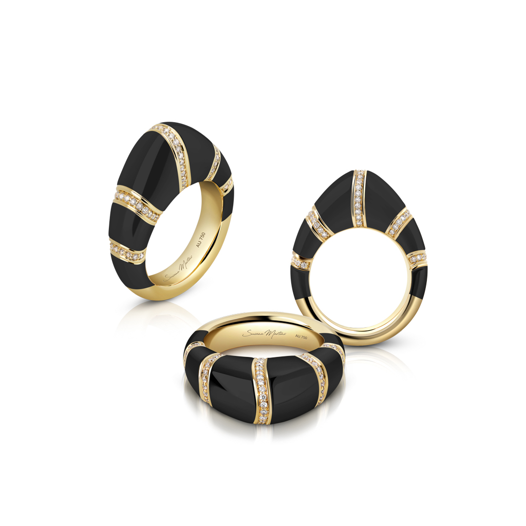 Three dome rings featuring black enamel and gold accents with diamond embellishments.