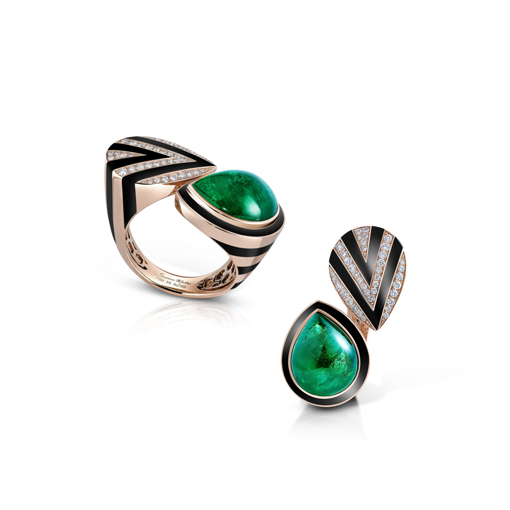 Emerald and black compo ring alongside an emerald and black compo earring on a white background.