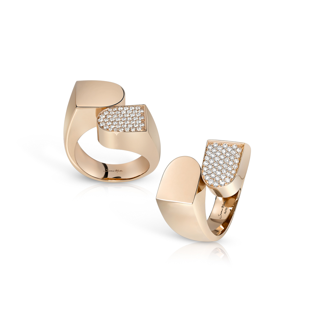 Two gold rings featuring a design with diamond frosting on one side of each ring.