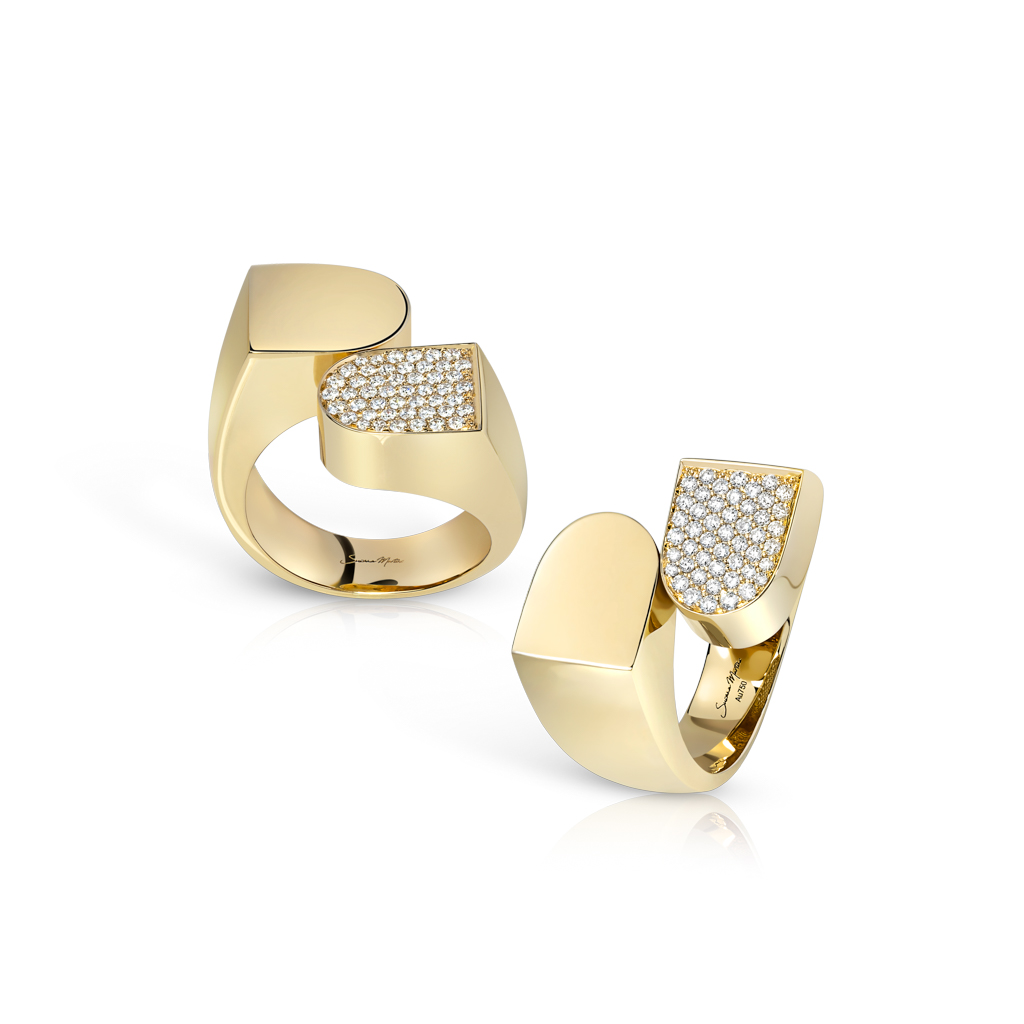 Two gold rings featuring diamond frosting on one side, showcasing a modern design.