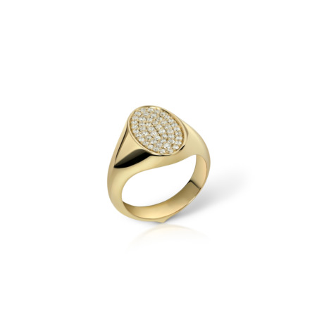 Gold signet ring featuring an oval top with a paved design of small stones.