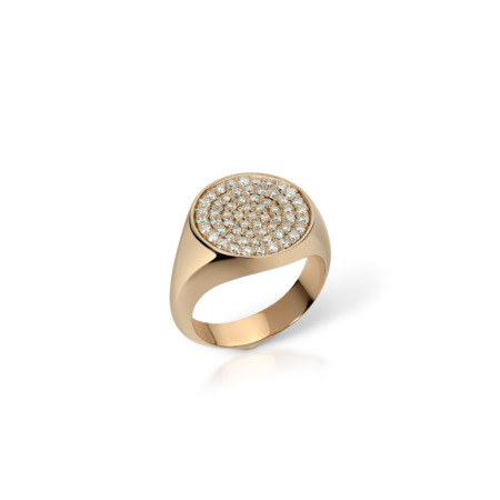 Gold signet ring featuring a round top with paved stones set in a circular pattern.