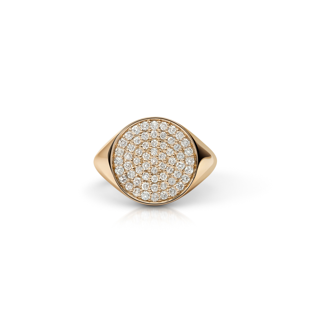Gold signet ring featuring a round design set with multiple small diamonds.