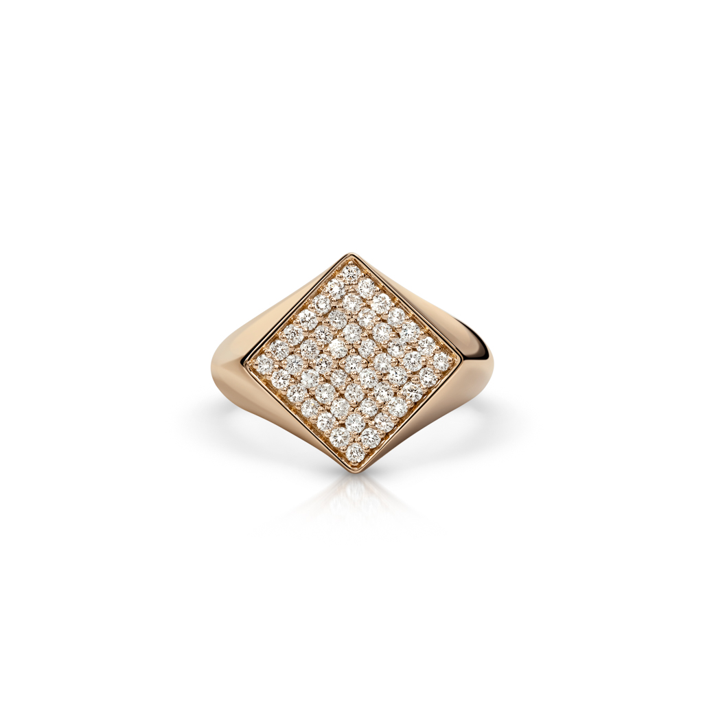 Gold signet ring featuring a square top with diamond accents arranged in a grid pattern.