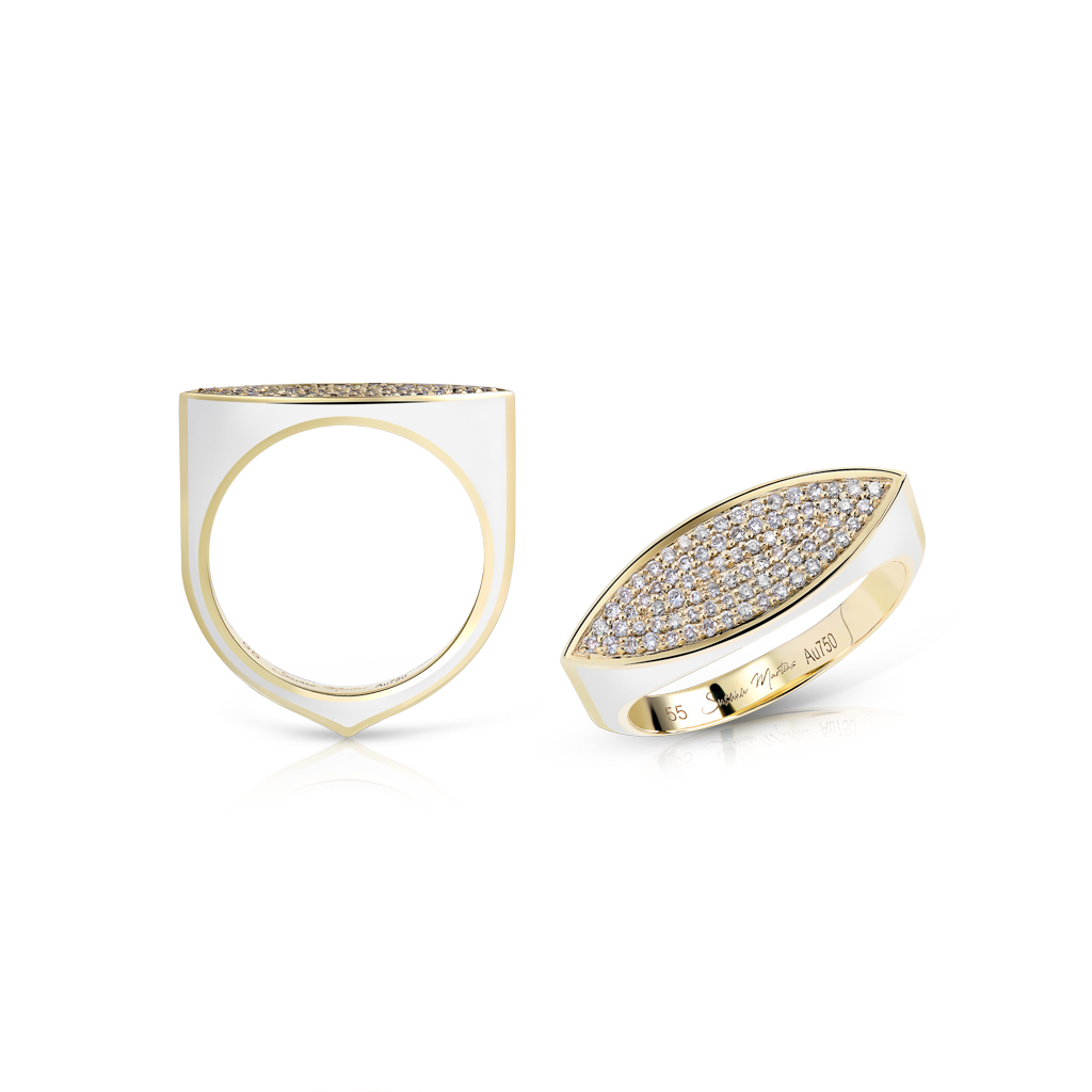Gold ring featuring a marquise design with pave-set white stones on the surface.