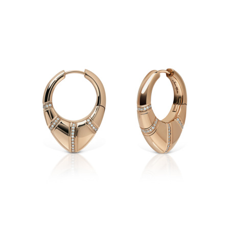 Gold and silver hoop earrings featuring diamond accents in a modern design.