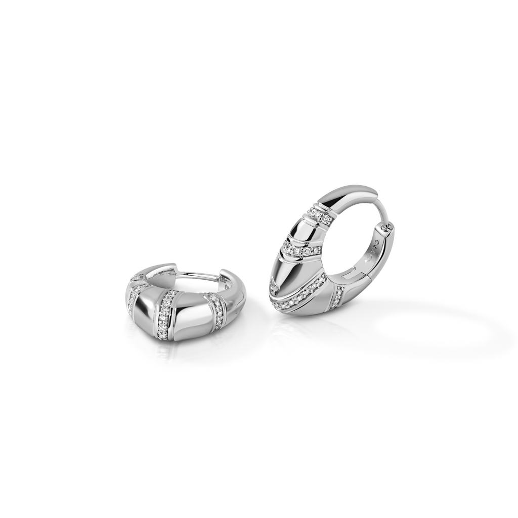 A pair of silver hoop earrings featuring a decorative design and small embedded stones.