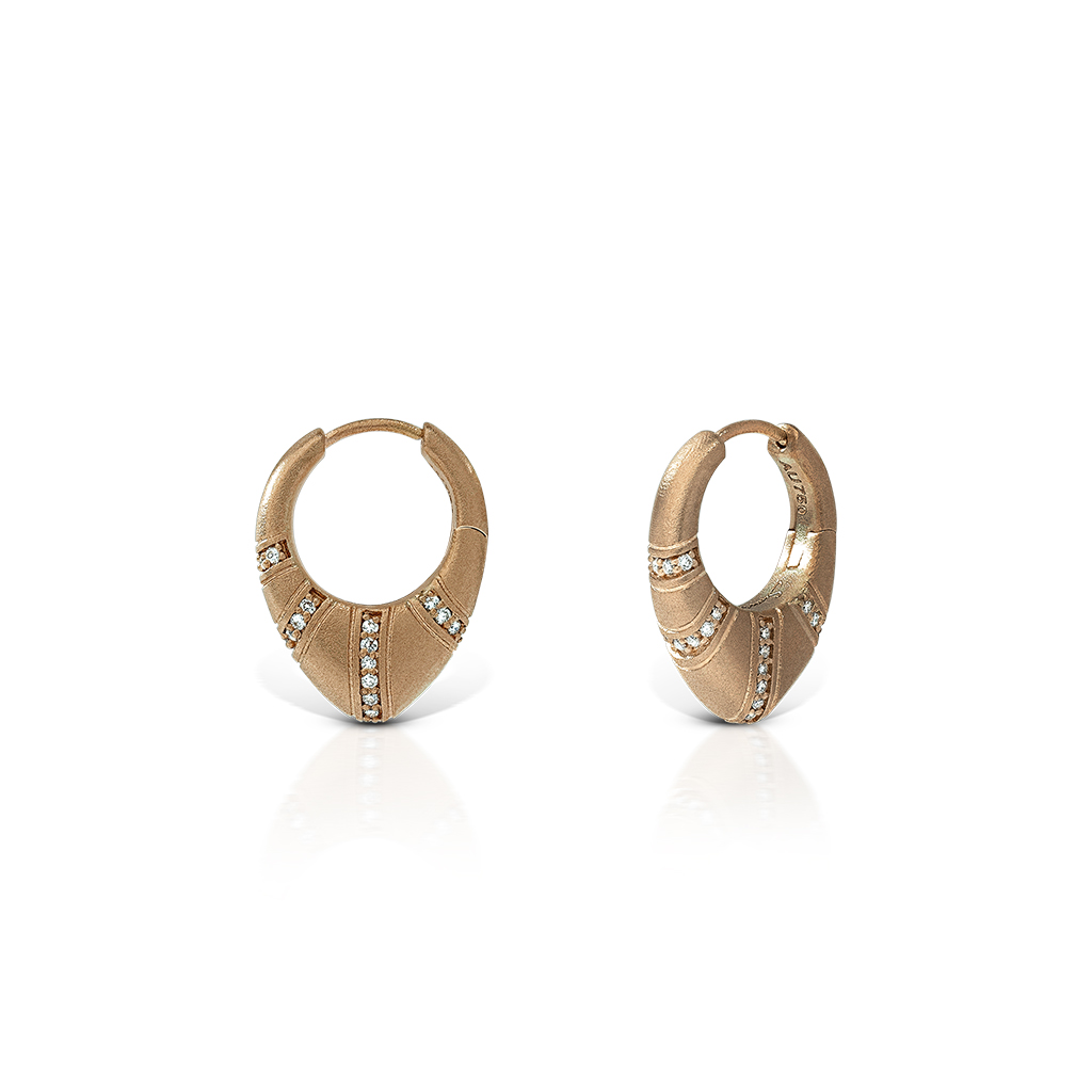 Gold hoop earrings featuring a decorative design with small gemstones embedded.