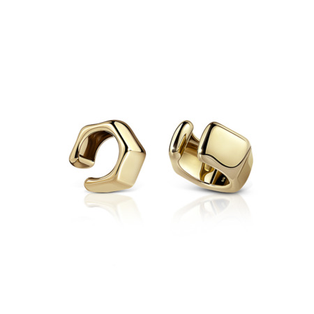 Two gold ear cuffs with a modern design, featuring smooth and geometric shapes.