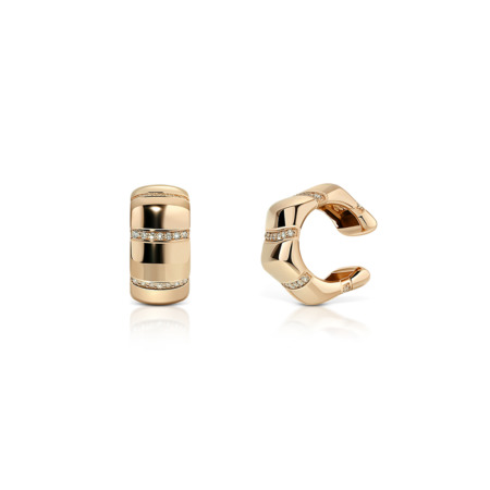 Gold ear cuff featuring diamond accents in a modern design.