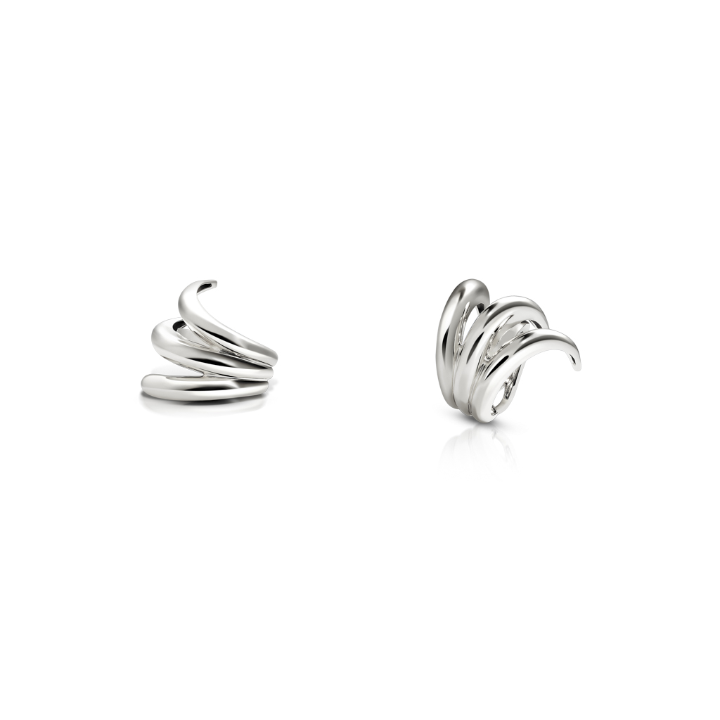 Two silver ear cuffs with a swirling design, showcasing a glossy finish and three strokes.