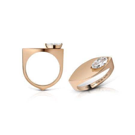 Marquise cut diamond ring set in rose gold, featuring a unique design with a prominent stone.