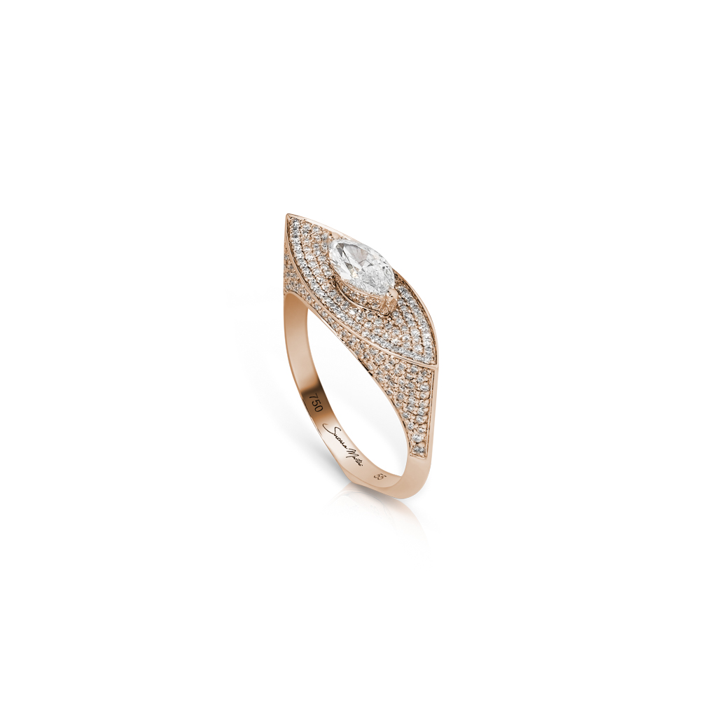 Rose gold ring featuring a marquise diamond and smaller diamonds set in a unique design.