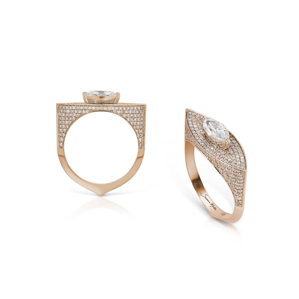 Two marquise diamond rings in rose gold with intricate designs and multiple smaller diamonds.