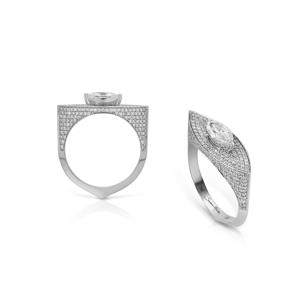 Marquise diamond ring featuring a frosted design and intricate detailing on the band.