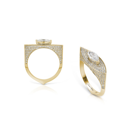 Two rings featuring marquise diamonds set in yellow gold with intricate designs.