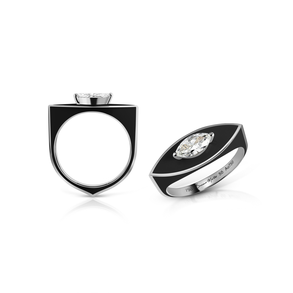Marquise-shaped ring featuring a white gemstone and black enamel design.