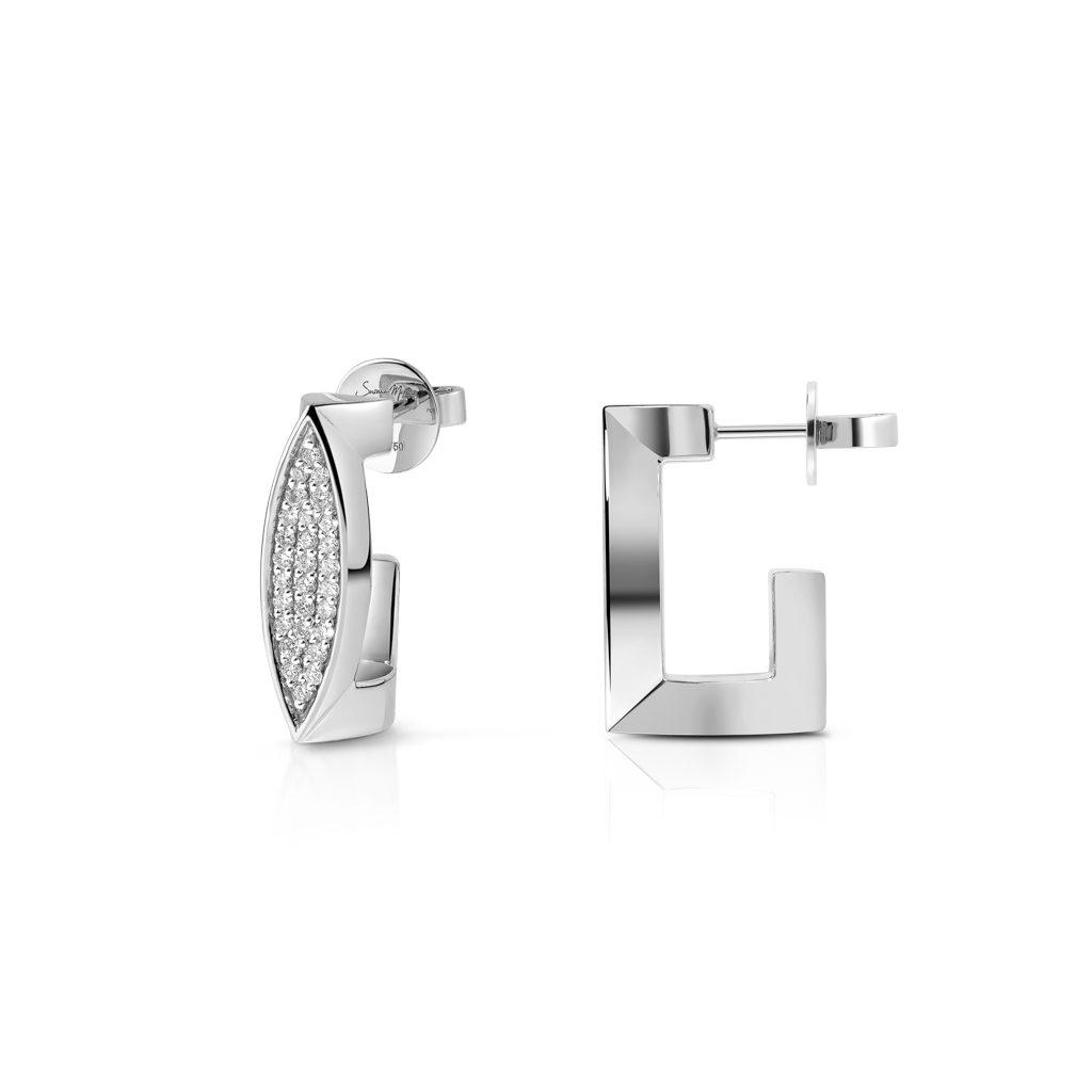 Medium ear clips featuring diamond frosting set in white gold with a geometric design.