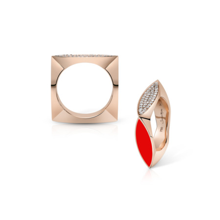 Two rings featuring a square and a curved design with red and clear enamel accents.