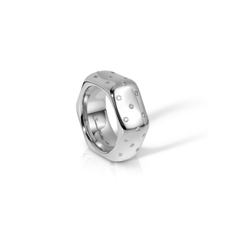 White gold ring with a hexagonal shape and polka dot design, featuring small embedded stones.